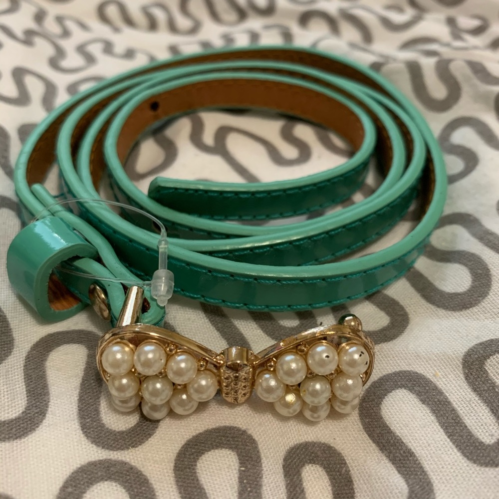 Thin turquoise belt with butterfly embellishment M